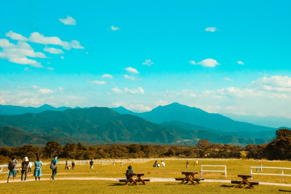 view of people and mountains in Yamanashi, Japan