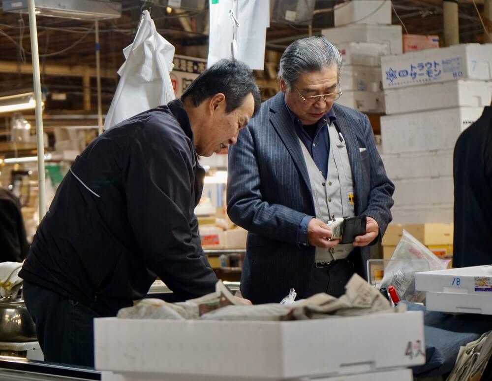 two Japanese men at a market
