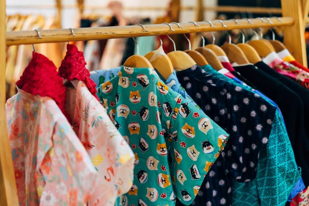 a rail of colourful women's clothing