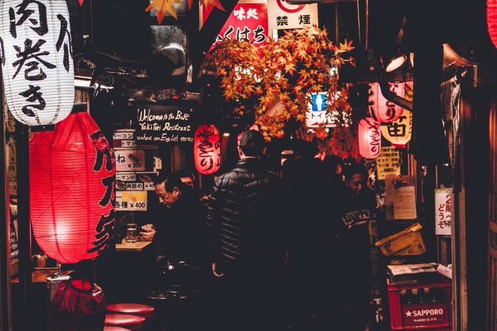 people lining up for drinks in Tokyo