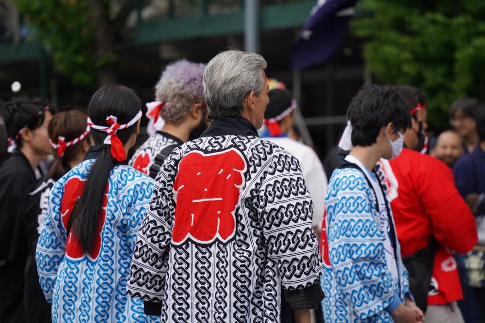 man wearing a haori in a crowd