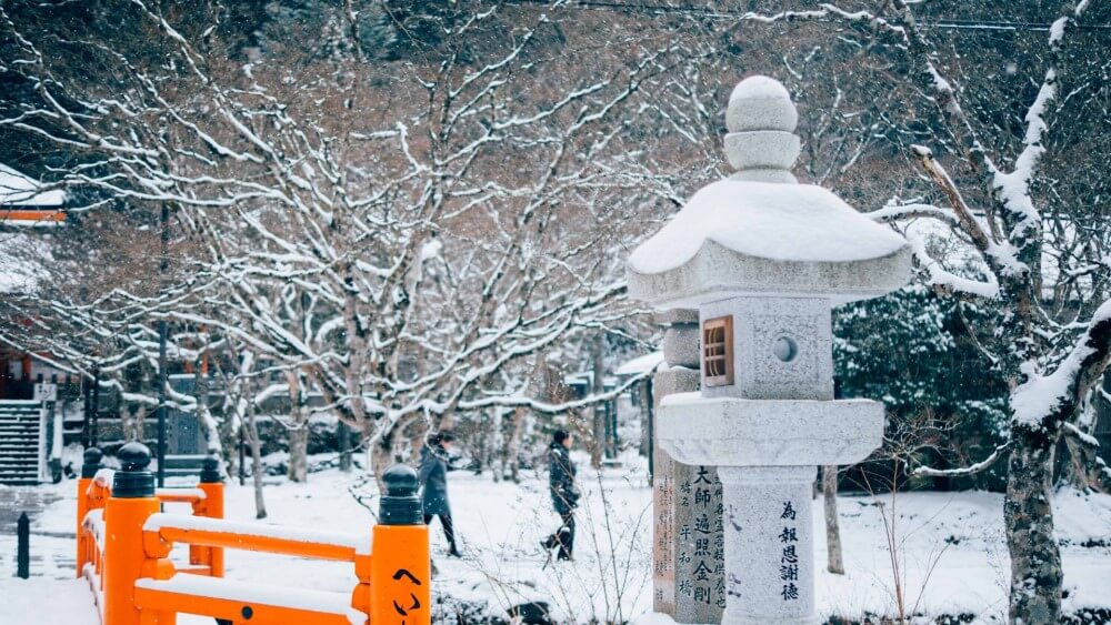a snow covered cemetery in Japan