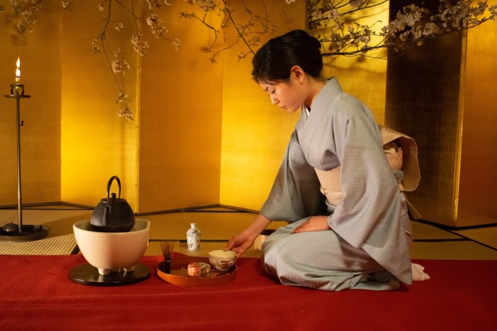 a woman doing a Japanese tea ceremony