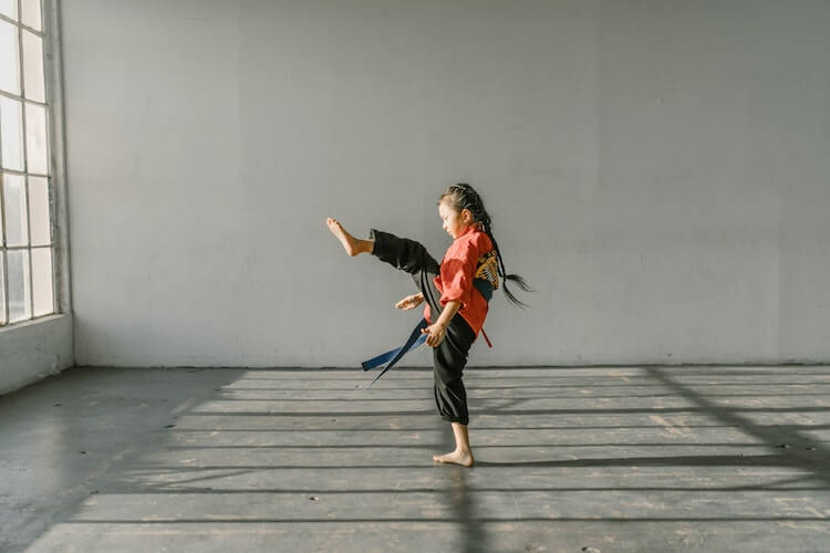 Girl practising Japanese martial art aikido