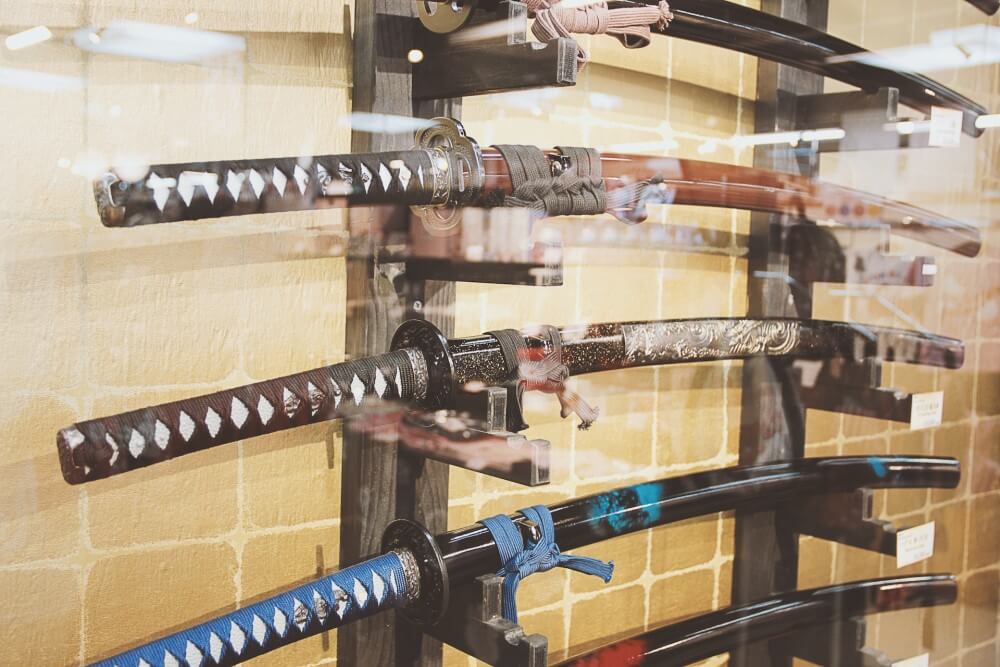 a wall rack of Japanese swords