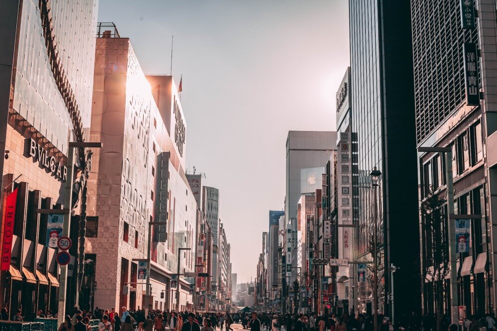 sun reflecting of a city street in Japan