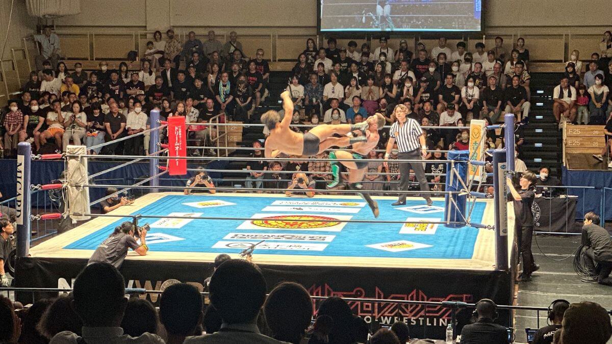 a flying kick at a Japanese pro wrestling match