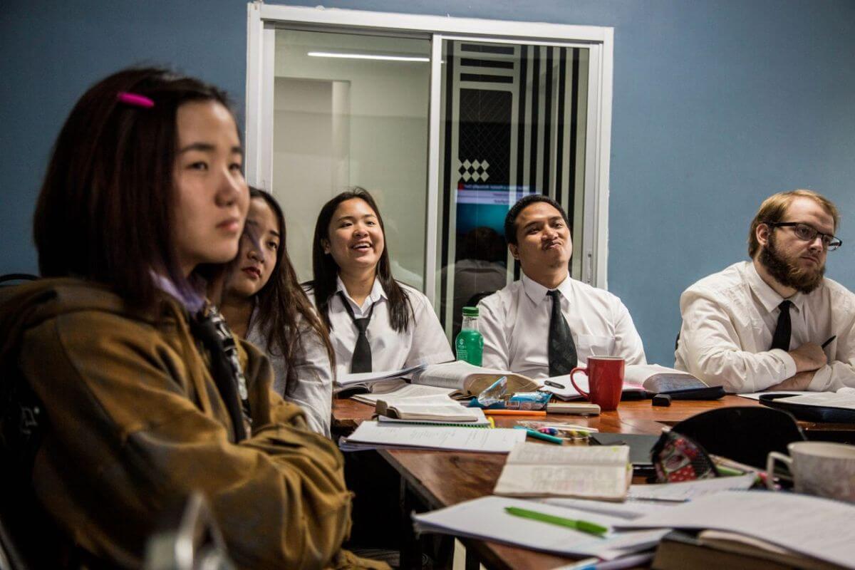 adults studying in a room